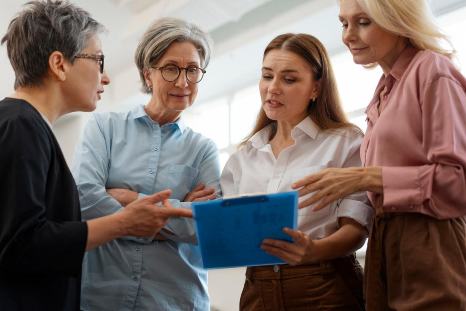 Professional workshop setting with financial planning materials and goal-setting documentation